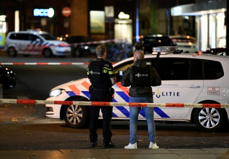 FILE PHOTO: Police officers surround the area where a suspect is said to be, in the centre of Nijmegen, Netherlands November 19, 2019. REUTERS/Piroschka van de Wouw