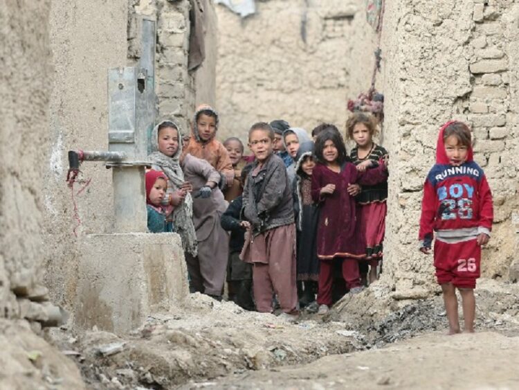 Internally displaced Afghan children looking on next to their shelters on the outskirts of Kabul, Afghanistan February 3, 2021. REUTERS/Omar Sobhani - RC26LL9HMZ56