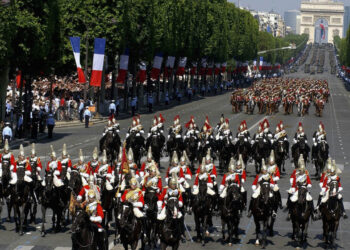 PARIS, FRANCE ? JULY 14: In this handout from the British Army, the Household Cavalry Mounted Regiment ride down the Champs Elysees at the start of the annual Bastille Day Parade July 14, 2004 in Paris, France. The Grenadier Guards were guests of the French Government to celebrate the 100th anniversary of the Entente Cordiale, a treaty of friendship signed in 1904. (Photo by Mike Harvey/British Army via Getty Images)