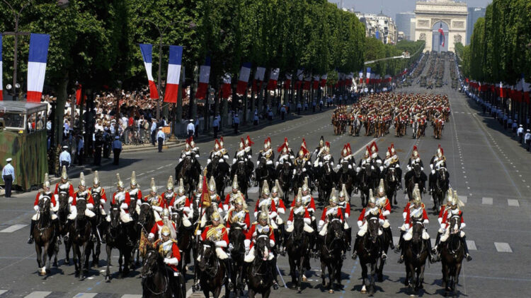 PARIS, FRANCE ? JULY 14: In this handout from the British Army, the Household Cavalry Mounted Regiment ride down the Champs Elysees at the start of the annual Bastille Day Parade July 14, 2004 in Paris, France. The Grenadier Guards were guests of the French Government to celebrate the 100th anniversary of the Entente Cordiale, a treaty of friendship signed in 1904. (Photo by Mike Harvey/British Army via Getty Images)