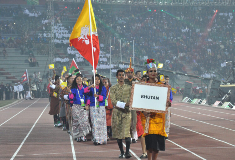 Bhutan players taking part in the ceremonial march pass on the occasion of the 12th South Asian Games-2016, at Indira Gandhi Athletics Stadium, in Guwahati, Assam on February 05, 2016.