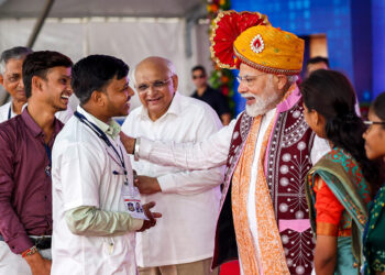 **EDS: IMAGE VIA @BJP4Gujarat** Bodeli: Prime Minister Narendra Modi and Gujarat CM Bhupendra Patel during an event, in Bodeli, Gujarat, Wednesday, Sept. 27, 2023. (PTI Photo) (PTI09_27_2023_000305B)