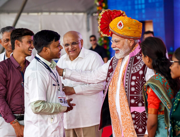 **EDS: IMAGE VIA @BJP4Gujarat** Bodeli: Prime Minister Narendra Modi and Gujarat CM Bhupendra Patel during an event, in Bodeli, Gujarat, Wednesday, Sept. 27, 2023. (PTI Photo) (PTI09_27_2023_000305B)