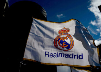 MADRID, SPAIN - JANUARY 31: A Real madrid flag flutters displayed at a merchandaising stall at Estadio Santiago Bernabeu outdoors before the La Liga match between Real Madrid CF and Real Sociedad de Futbol  on January 31, 2015 in Madrid, Spain.  (Photo by Gonzalo Arroyo Moreno/Getty Images)